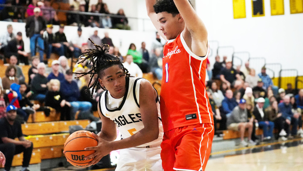two boys playing basketball