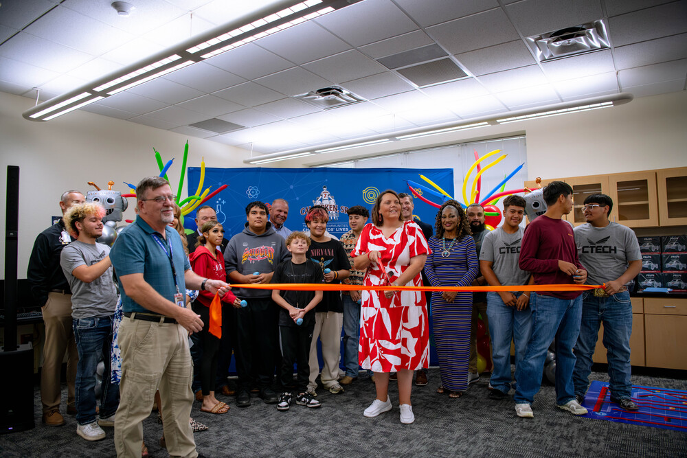 ALT school principal, Stacy Williams shown with several students celebrating the Cal Ripken Sr. Foundation Ribbon Cutting ceremony for the new STEM Center at the Alternative Learning Center.