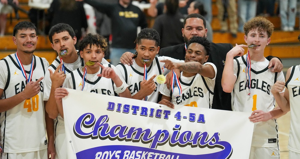 boys with medals and banner