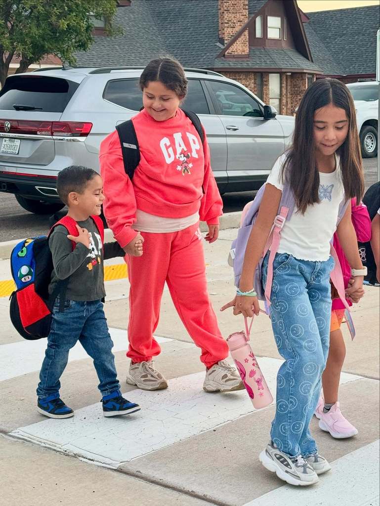 4 kids walking in crosswalk