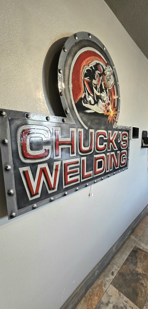 sign that states Chuck's Welding 