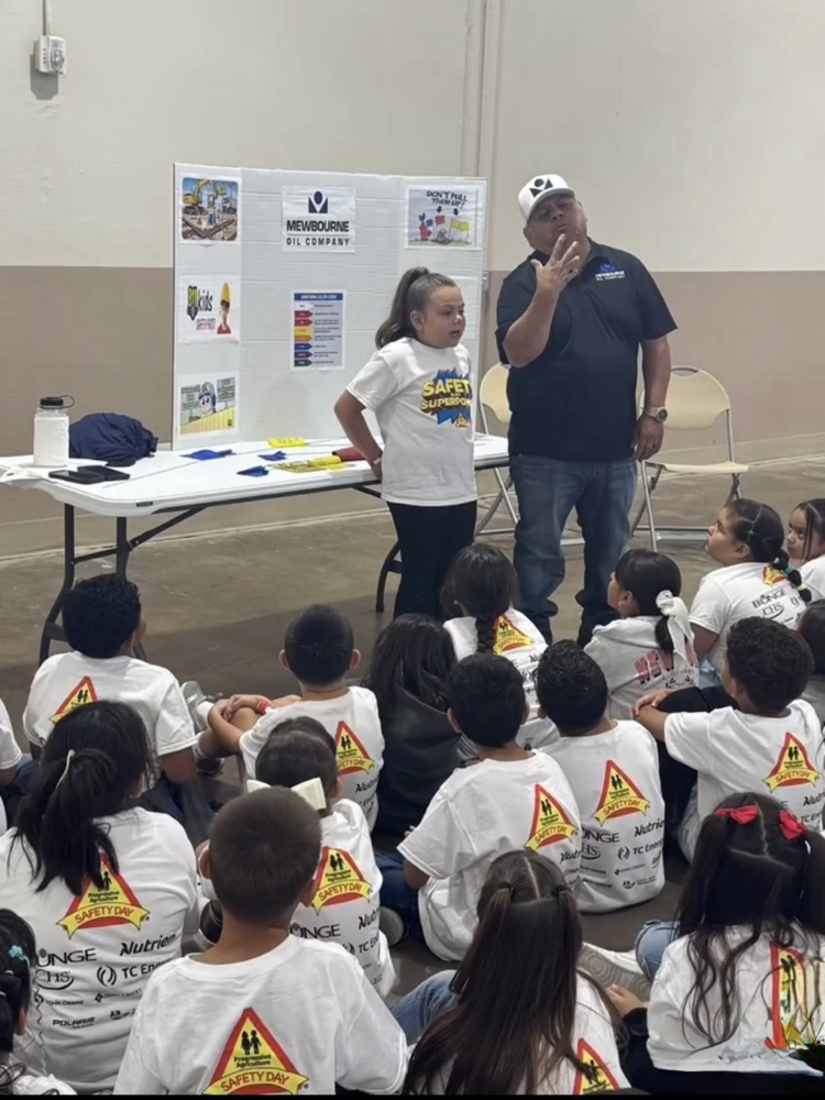 kids watching a man talking