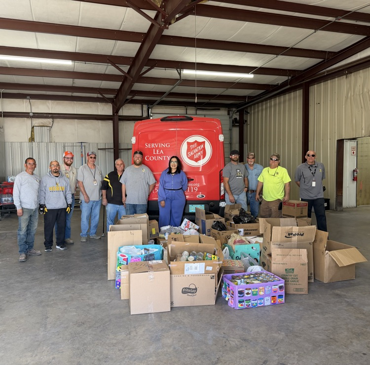 group of people with can goods for donation