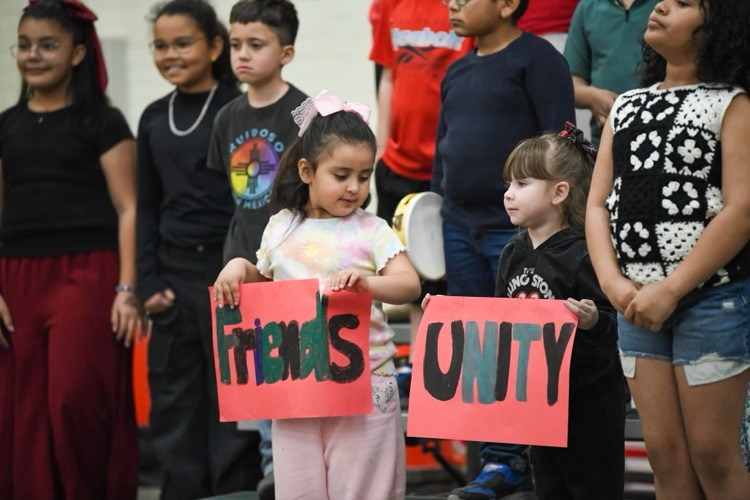 kids holding up signs