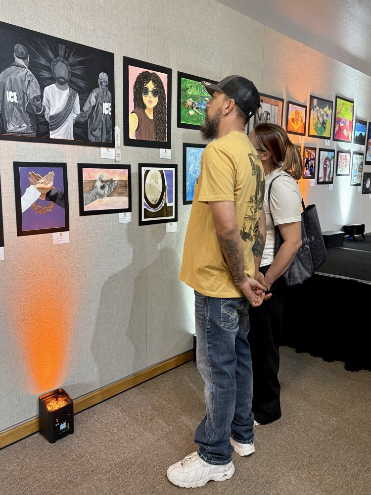 adults looking at art