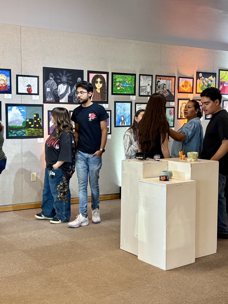 art gallery with people walking around