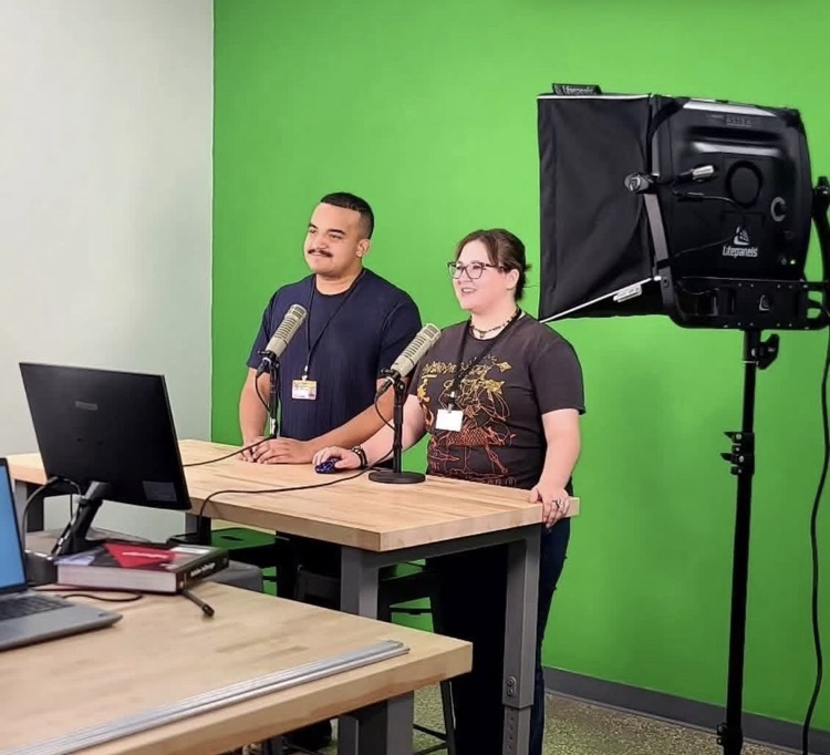 two students at TV studio 
