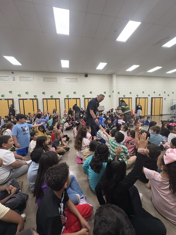 fireman passing out pencils