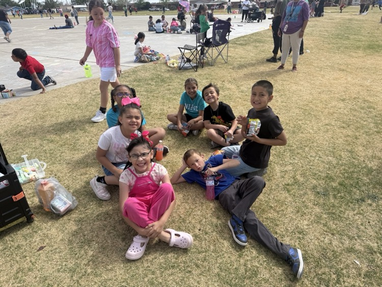 kids sitting on grass
