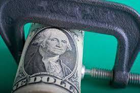 Picture of a dollar in a vice
