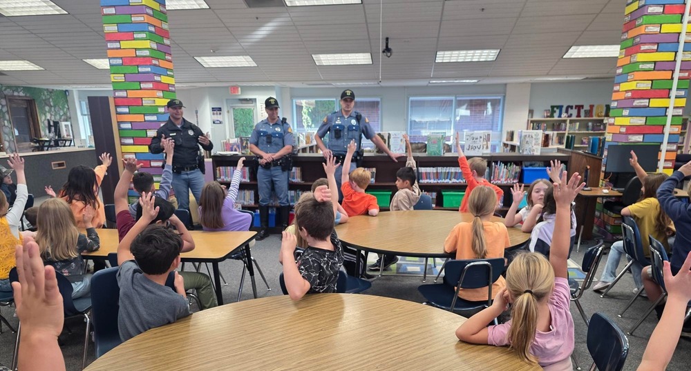 Police speak to a class in the library