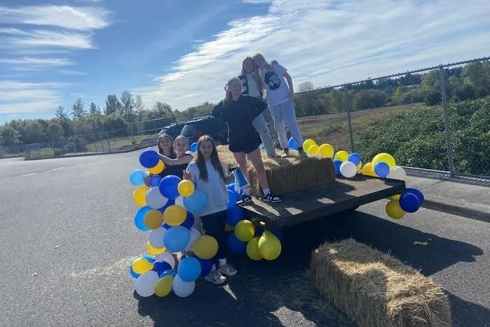 HMS Leadership students stand atop the Homecoming Float they created to represent HMS.