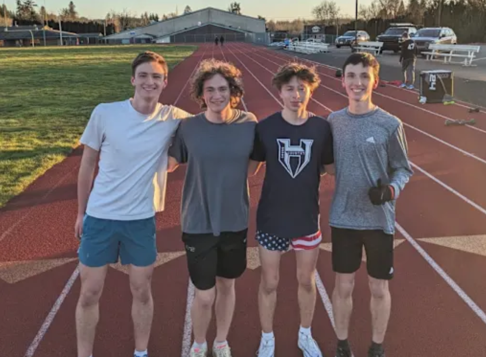 Ian Guasco (Grade 12), Liam Deviney (12), Bjorn Lundsgaarde (10), and Tanner Hood (10) on the Track & Field Team.