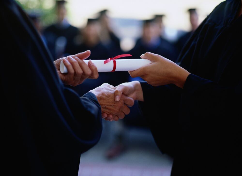 Diploma exchanging hands