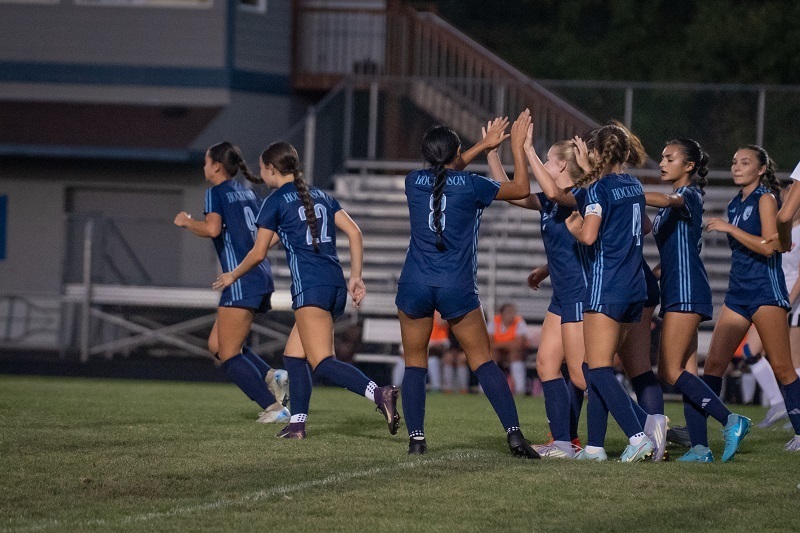 Photo of girls celebrating during a game
