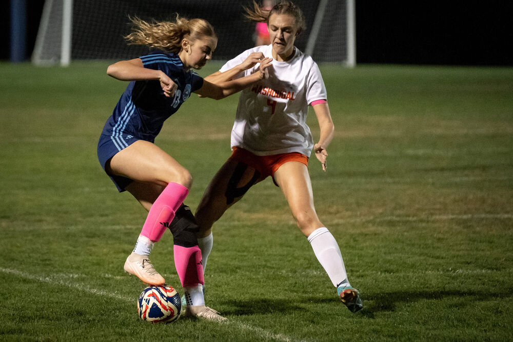 HHS & WHS Soccer Players Challenging for Control of  the Ball