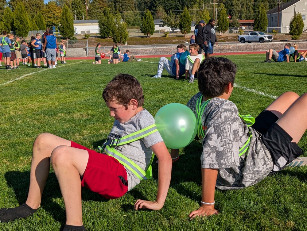 Students Back-to-Back with Balloon