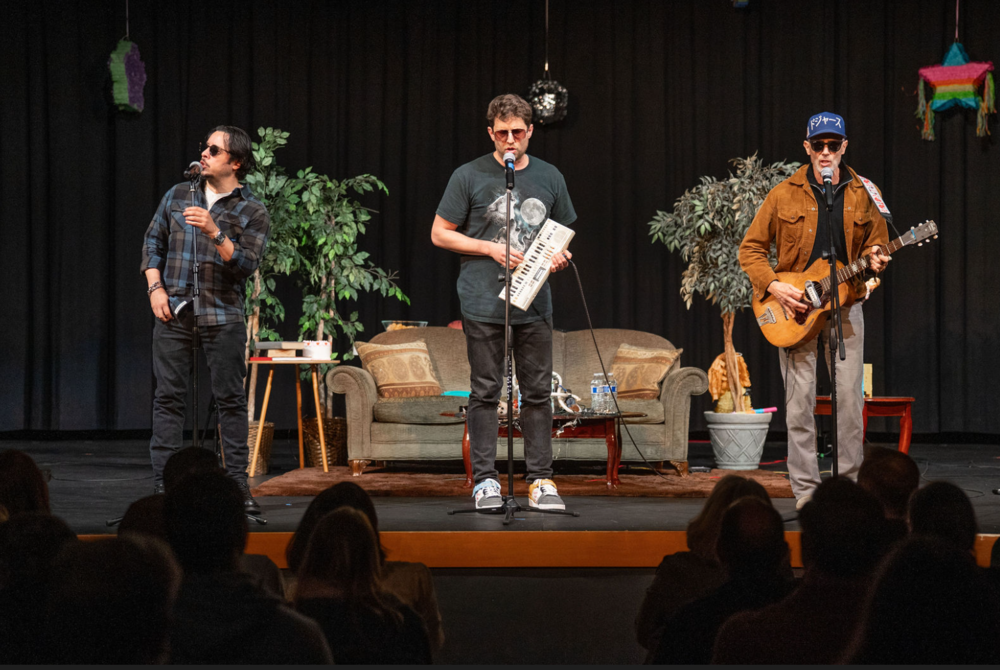 Photo of Napoleon Dynamite Headliners on stage at 3/6 event
