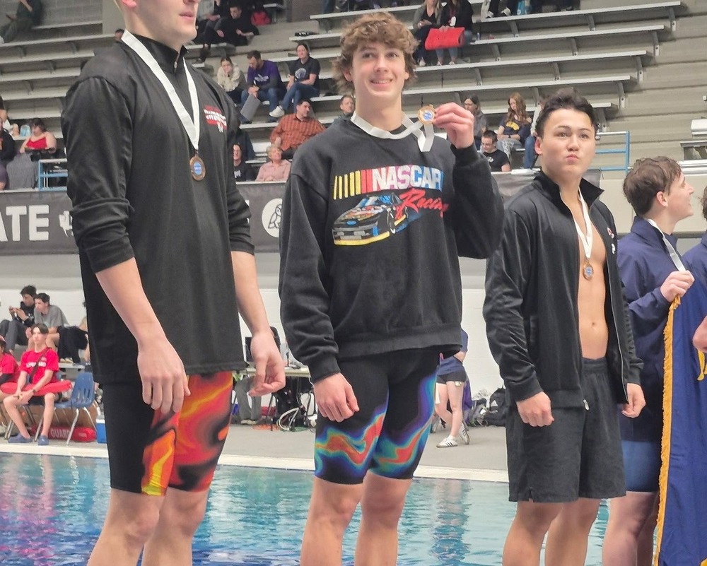 Photo of Ryder Hough at State Swim Meet Podium
