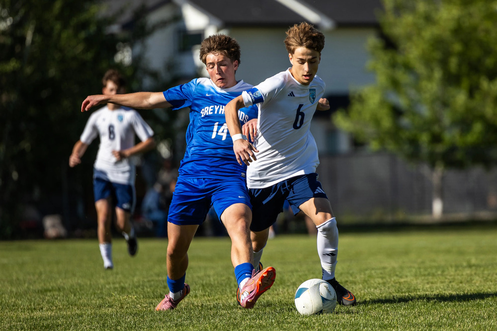 Ryder Cole-Vogler battles for control of the ball in HHS's Round of 16 game v. Pullman HS