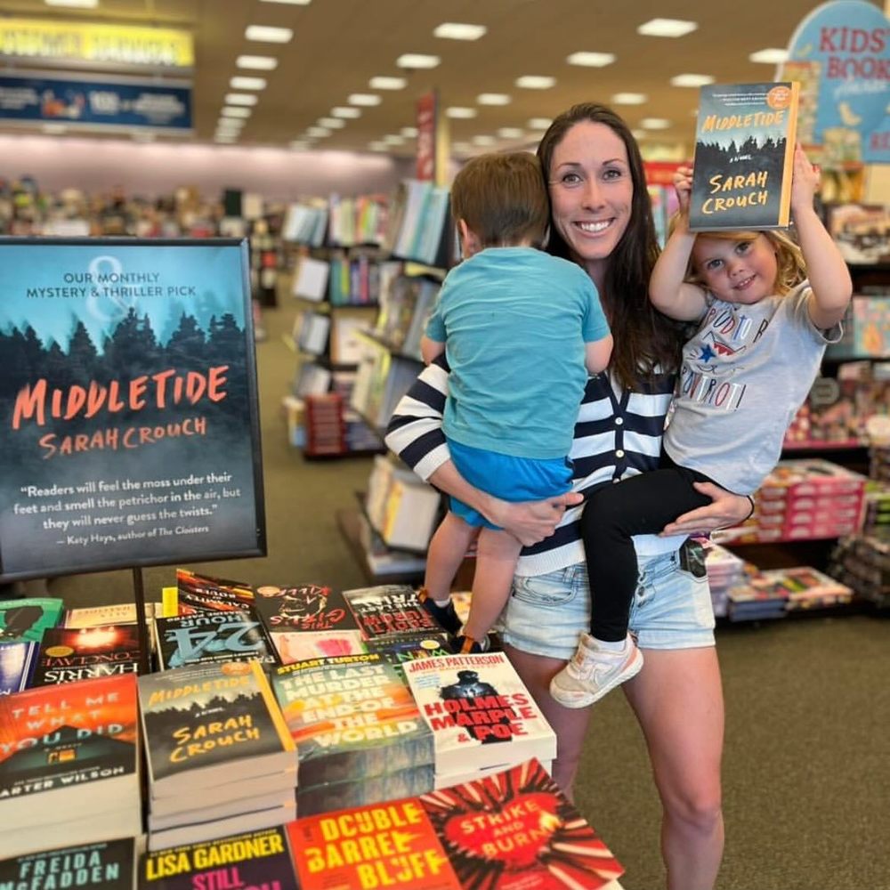 Picture of author Sarah Crouch with her novel and her 2 children