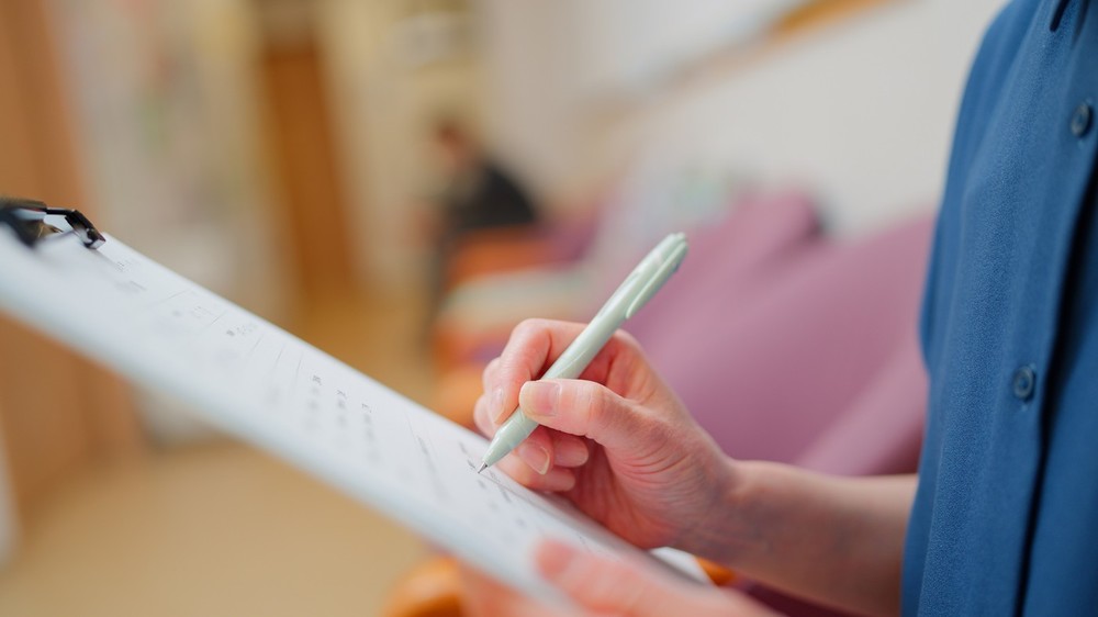 Photo of a woman writing.
