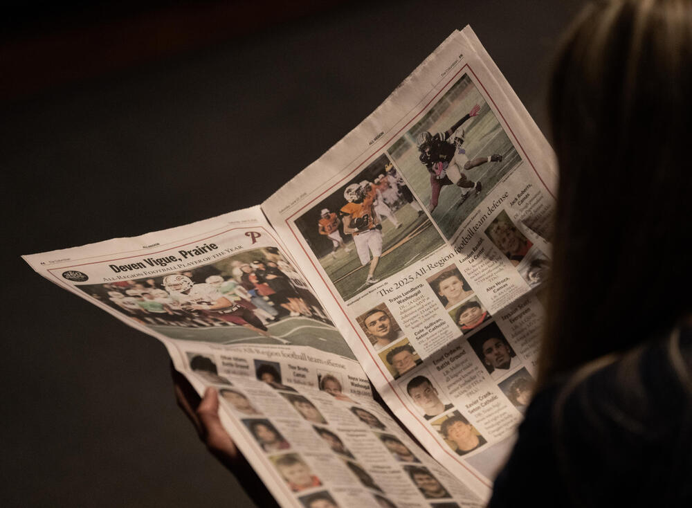The Columbian newspaper open to the high school sports news section.