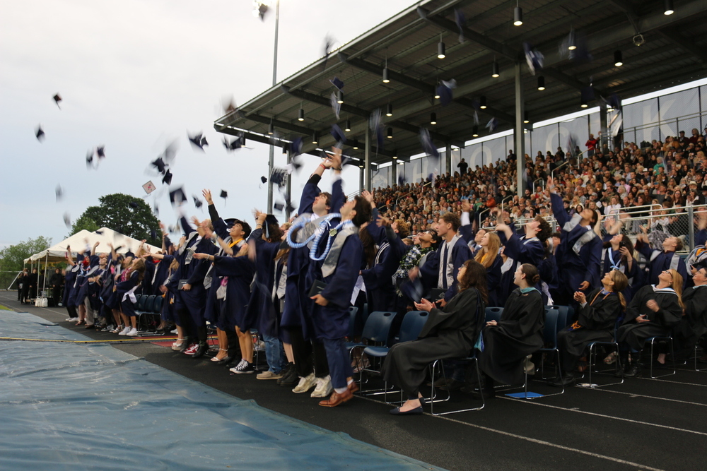 Picture of HS throwing hats in  the air