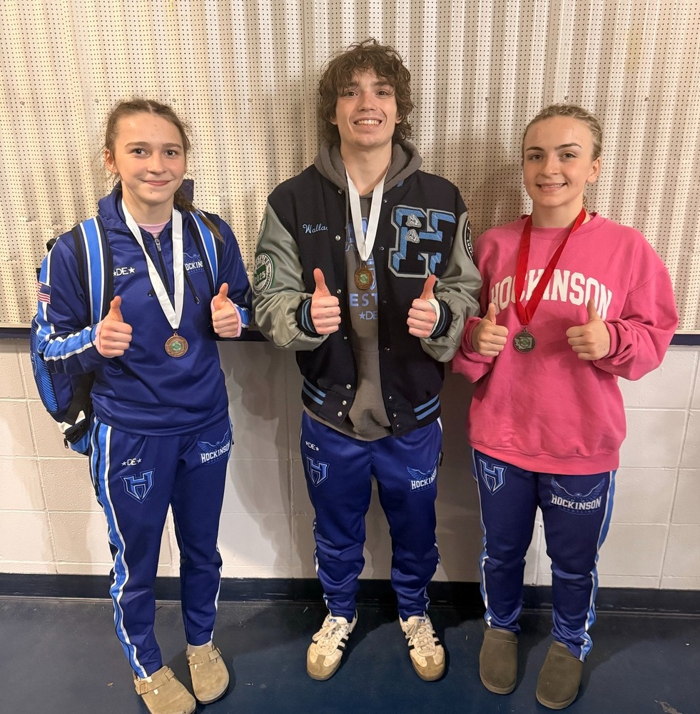 HHS Wrestlers who placed at Stat: Makenzie Carter, Austin Wallace, and Teagan Trendae