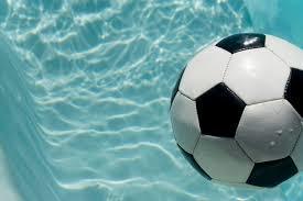 Soccer ball in swimming pool