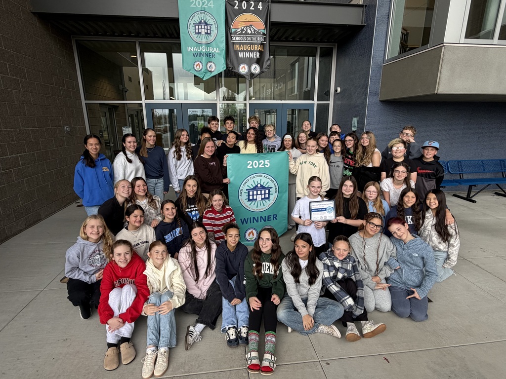 Leadership students proudly displaying our new banner!