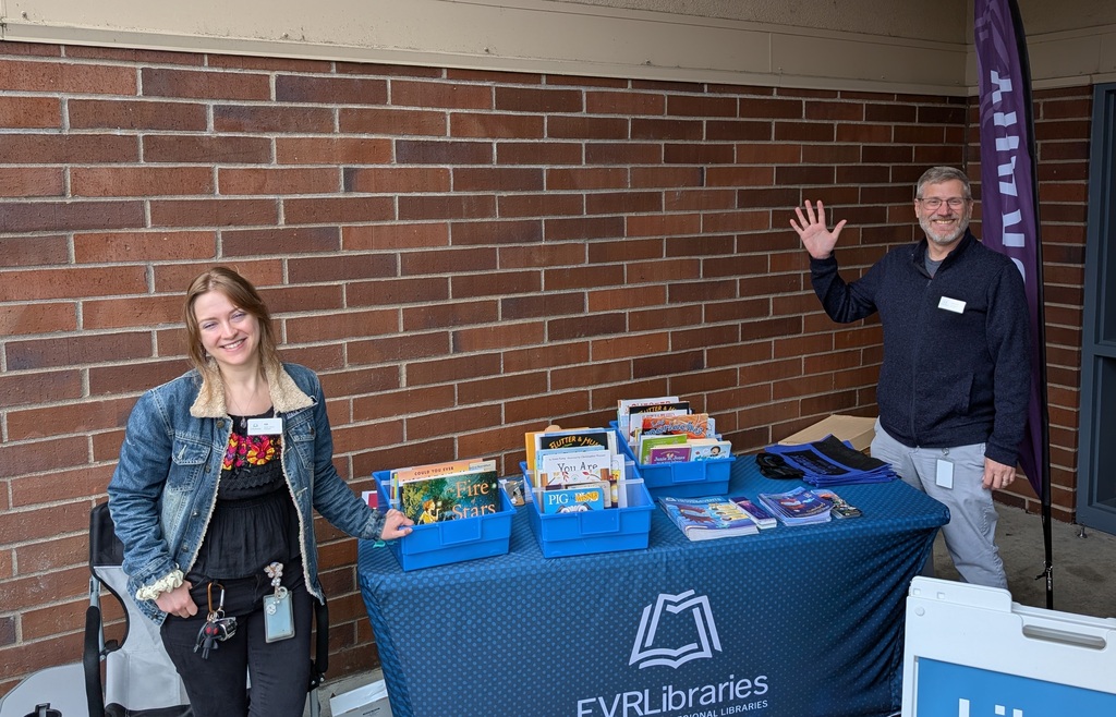 Picture of FVRL workers welcoming visitors to participate in Bookmobile services