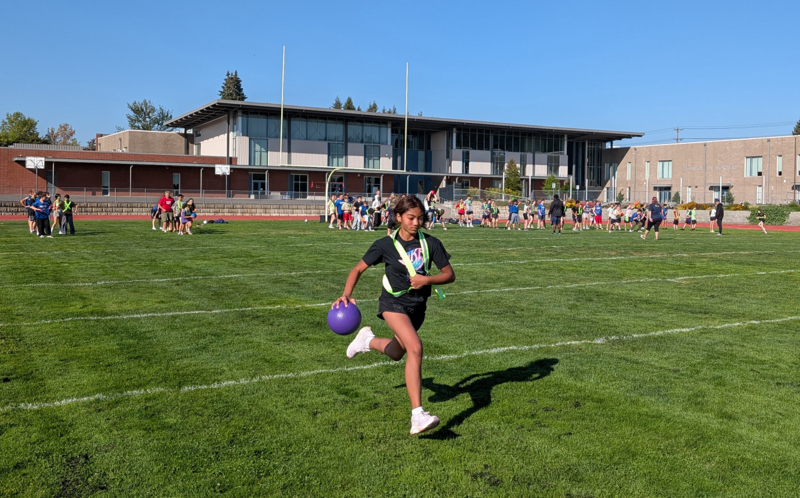 Girl running with ball
