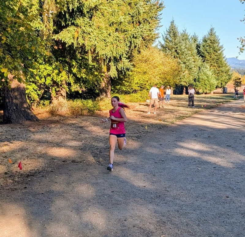 High school girl running outdoors