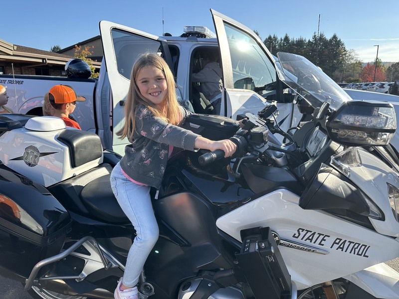 Girl on a state patrol motorcycle
