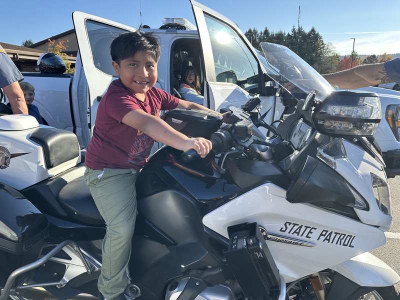Boy on a state patrol motorcycle