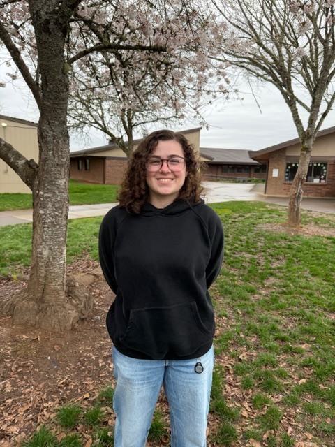Woman poses outdoors