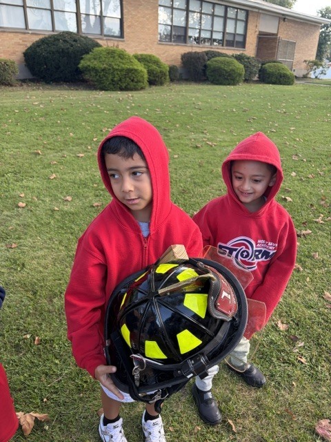 kids by the firetruck