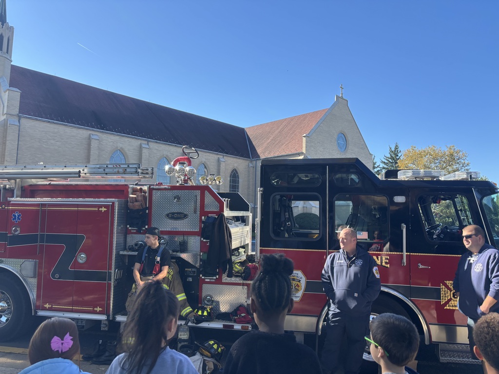 kids by the firetruck