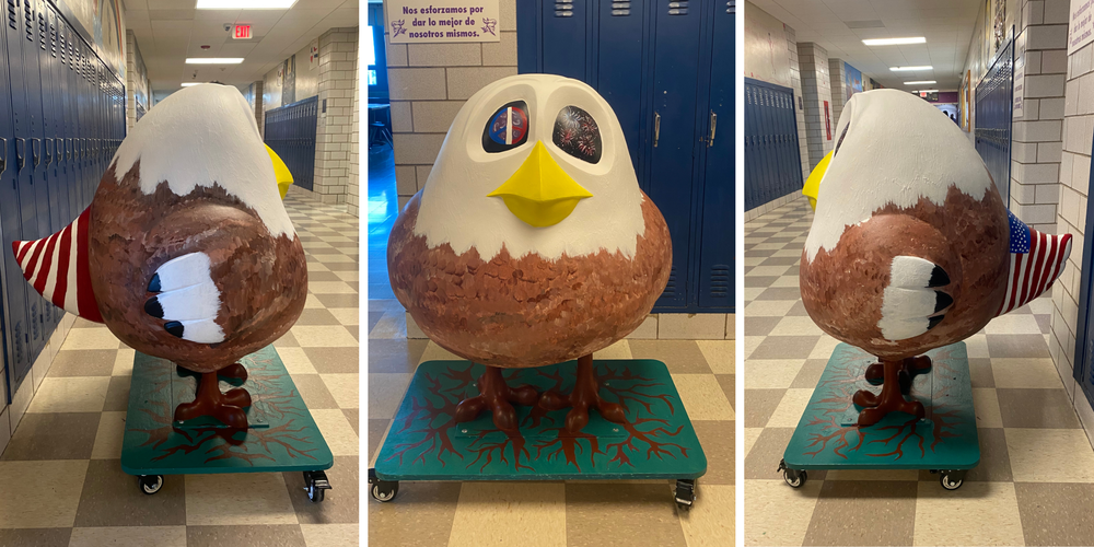 photos of bird statue painted with American symbols