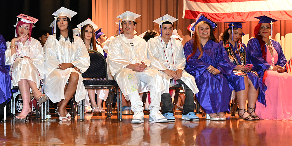 Graduating seniors wearing caps and gowns