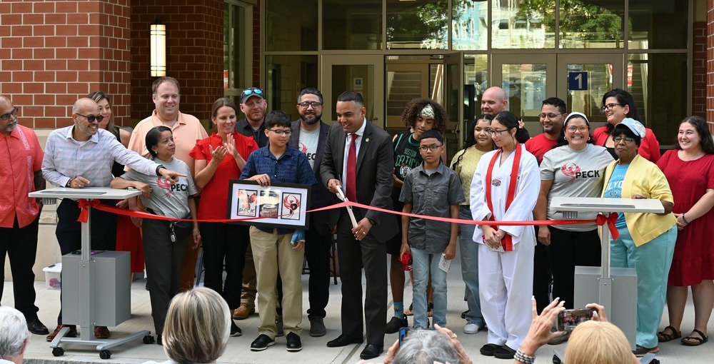 Staff and students cut the ribbon with the Mayor at Peck