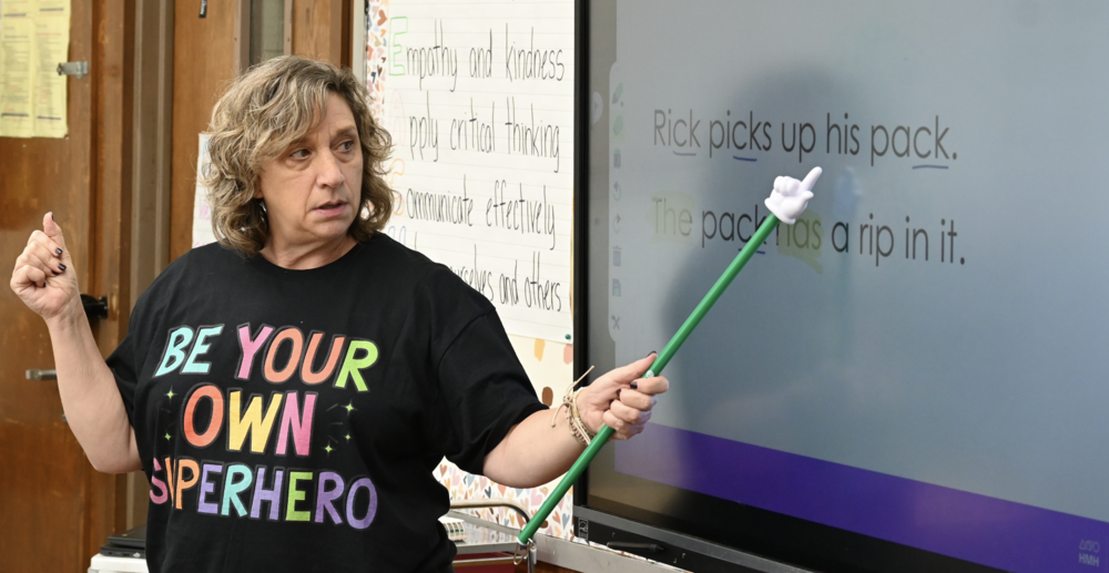 Amy Drohan instructs students in reading aloud