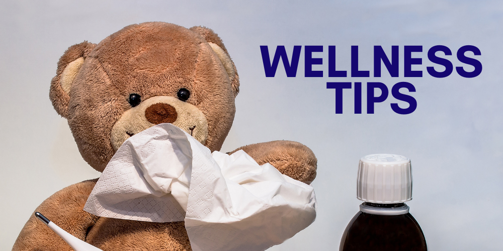 Teddy bear with kleenex and thermometer with text: Wellness tips