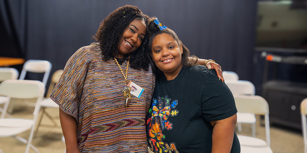 Two women standing next to each other