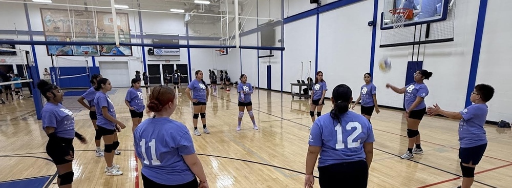 Students huddle up in gym of Boys and Girls club