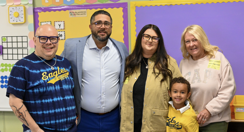 Principal Morris, Interim Superintendent Soto, Jackson, and his family