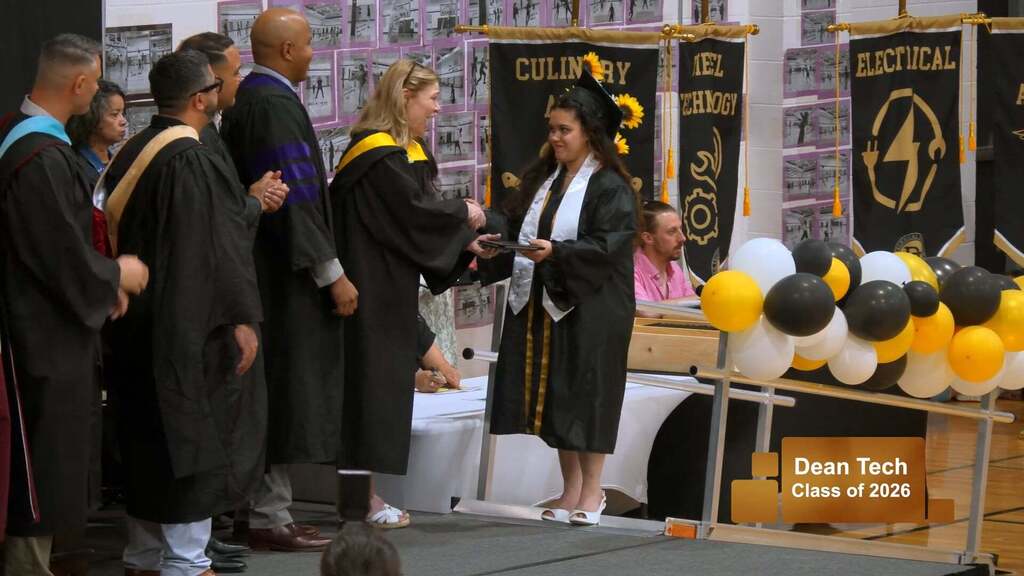 Female student receiving diploma