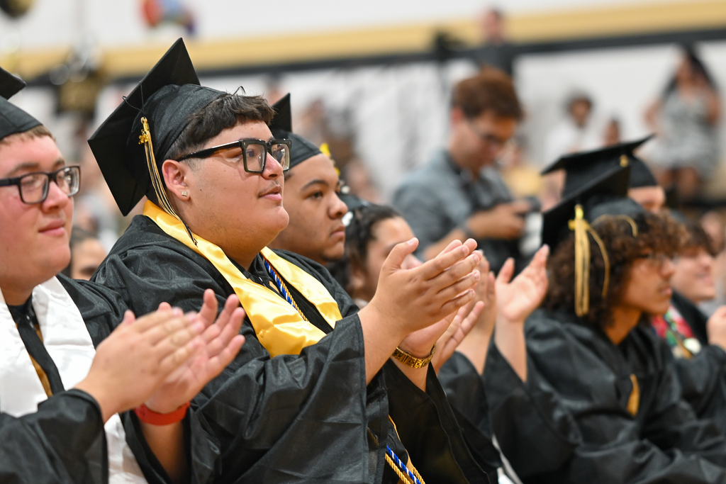 Graduates applaud speaker