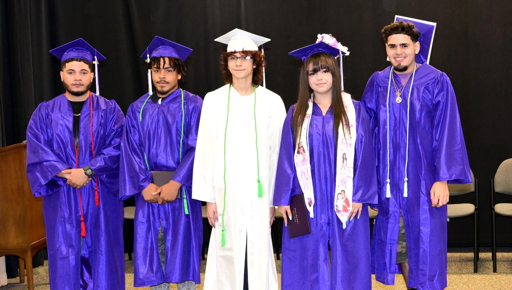 Five of the six graduates pose for a photo after the July 23, 2026 ceremony at the HPS Media center.